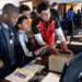 From left, Cass Tech students Nevin Brown, 16, Tartil Chowdhury, 14, Jordan Tucker, 14, and Erick Munoz check out a motion controller from Delta Tau in Dexter, during Michigan Robotics Day at the Jack Roth Stadium Club at Michigan Stadium on Monday, April 15, 2013. Melanie Maxwell I AnnArbor.com